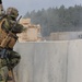 Czech army soldier fires at enemy combatants during training exercise