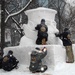 The Navy Misawa snow sculpture team get detail oriented