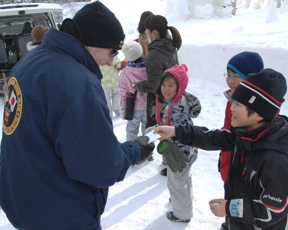 The Navy Misawa snow sculpture team get detail oriented