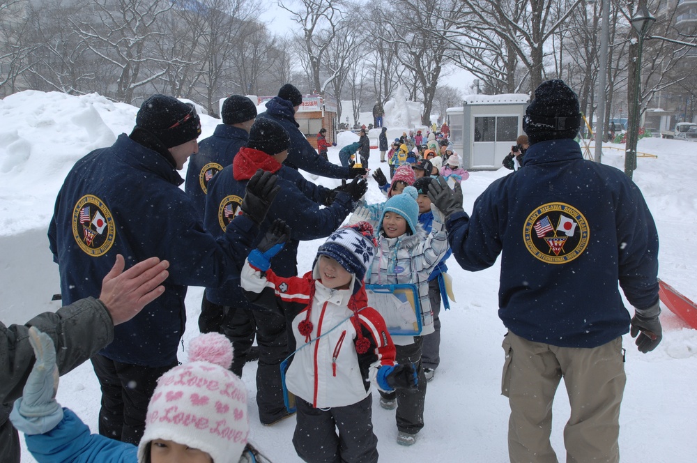 The Navy Misawa snow sculpture team get detail oriented