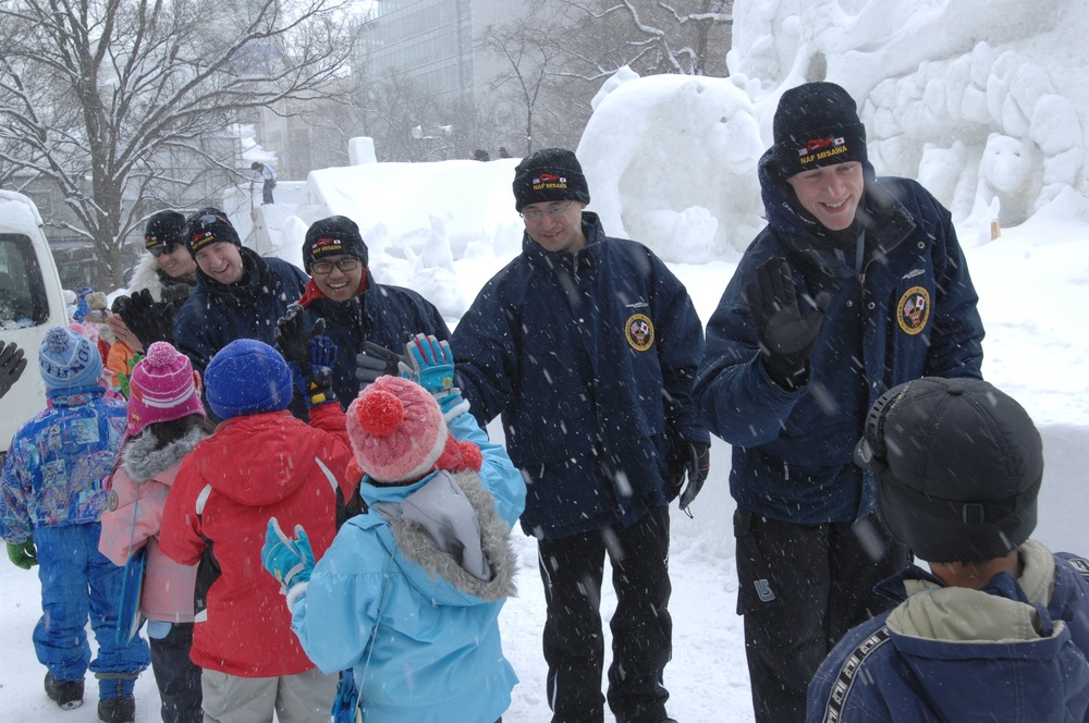 The Navy Misawa snow sculpture team get detail oriented