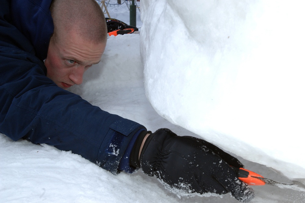 The Navy Misawa snow sculpture team get detail oriented