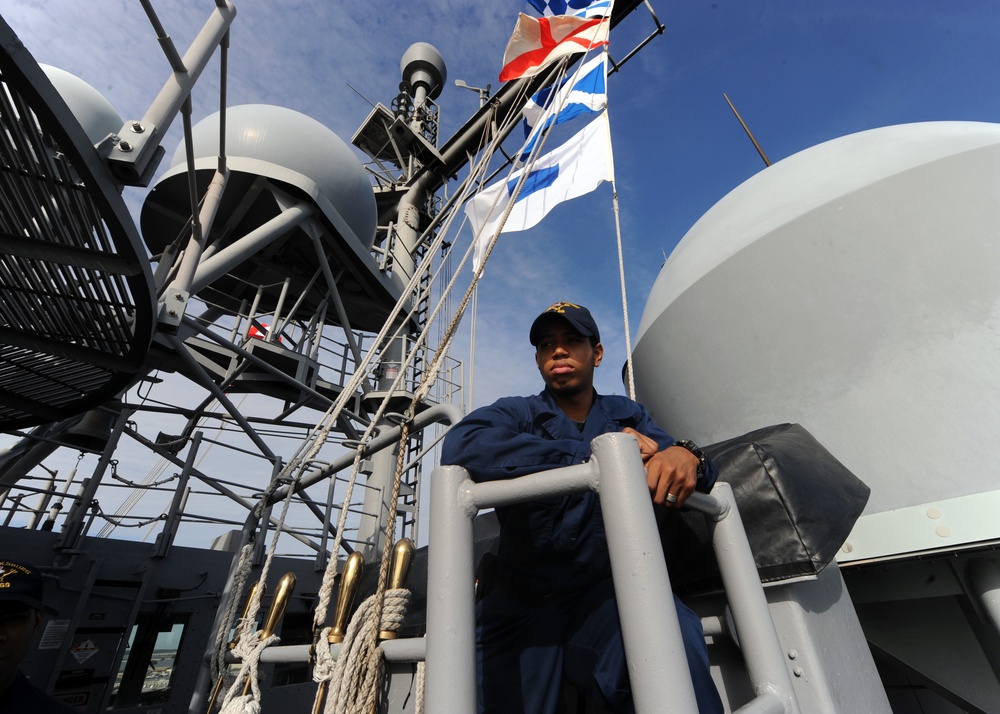 USS Vicksburg sailor looks out to sea