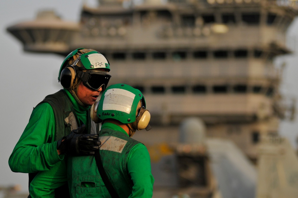 USS Carl Vinson sailors talk during flight operations