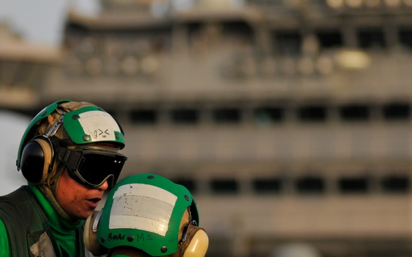 USS Carl Vinson sailors talk during flight operations
