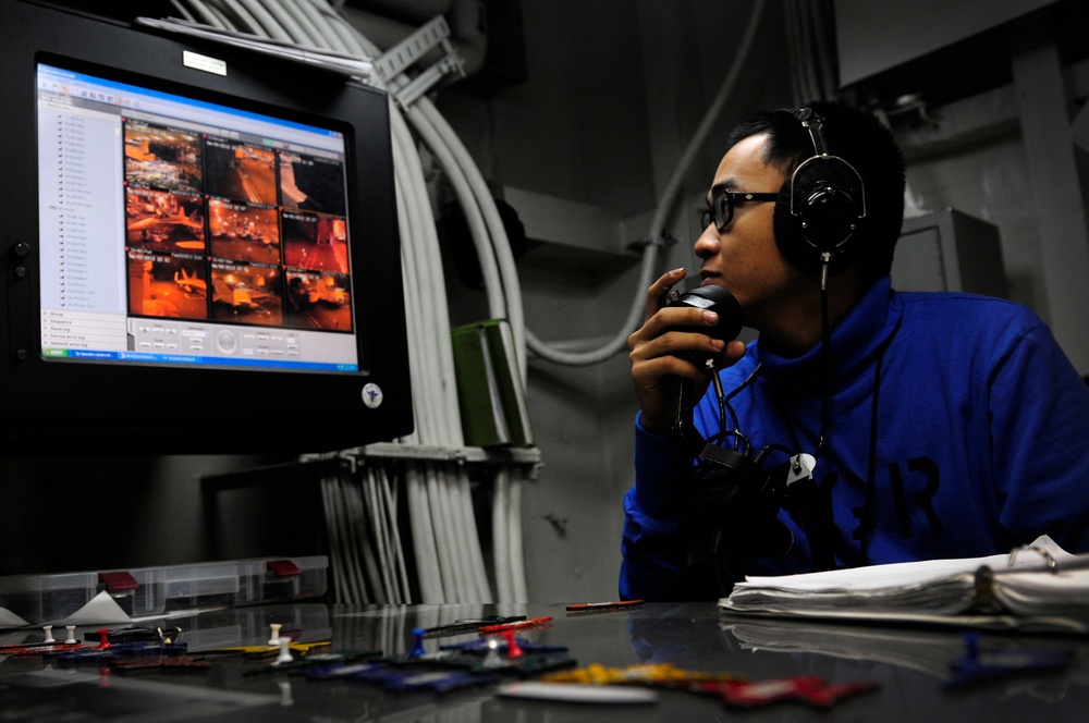 USS Carl Vinson sailor observe aircraft movement