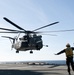 Sailor directs MH-53E Sea Dragon for landing