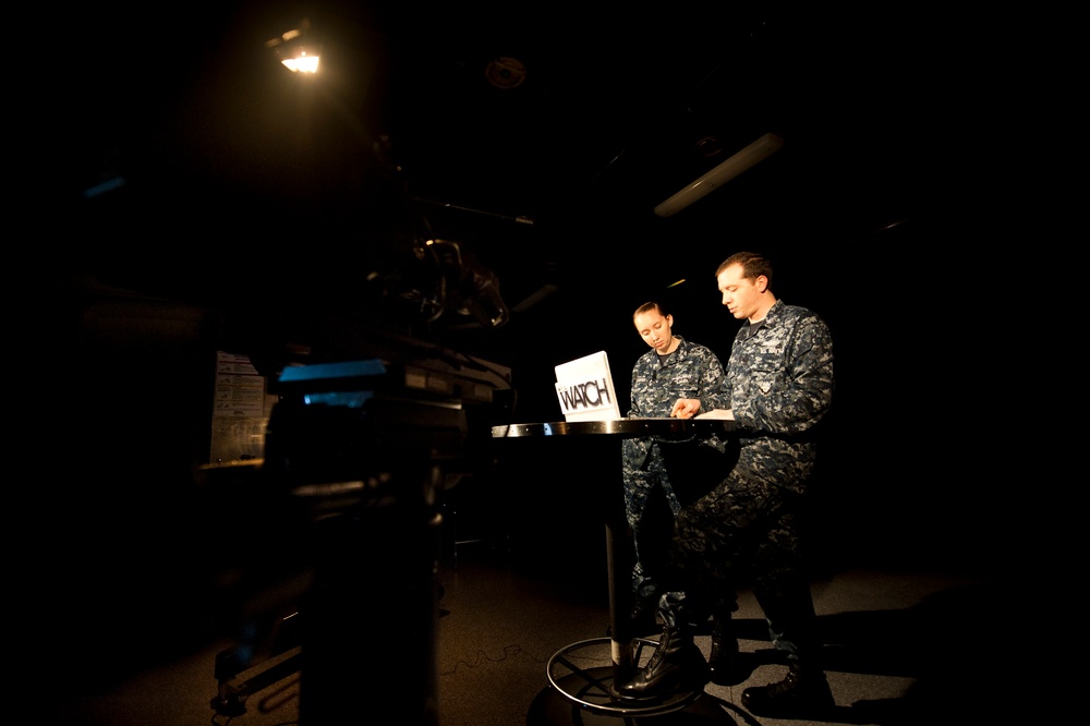 Sailors wait to film USS John C. Stennis news show