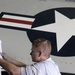 USS Carl Vinson sailor preps to remove plane wing