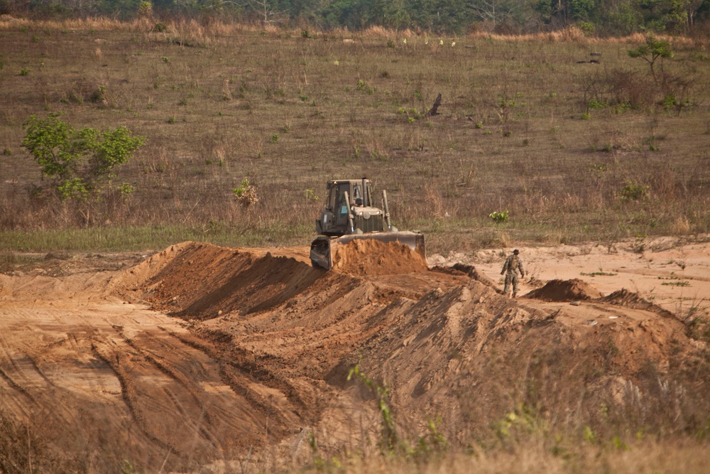 Heavy equipment operators construct range for Thai counterparts