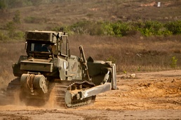 Heavy equipment operators construct range for Thai counterparts