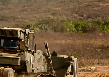 Heavy equipment operators construct range for Thai counterparts