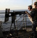 Firing a .50-caliber machine gun