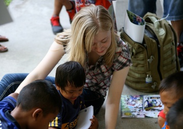 Service members interact with Thai patients