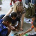 Service members interact with Thai patients