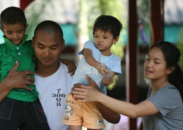 Service members interact with Thai patients
