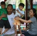 Service members interact with Thai patients