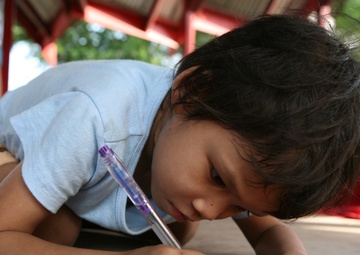 Service members interact with Thai patients