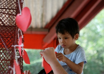 Service members interact with Thai patients