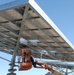 Sailor works on solar panel