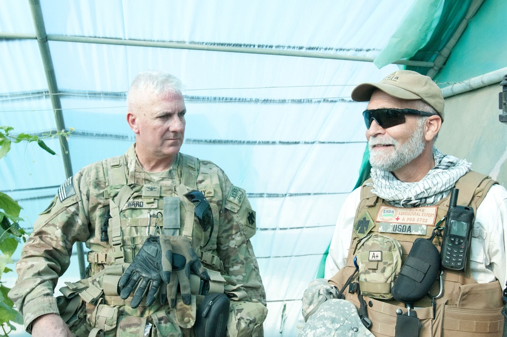 US and Afghan soldiers provide security during agriculture inspection