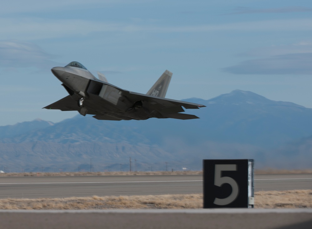 F-22 Raptors take offs