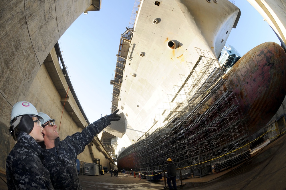 Sailors view USS Ronald Reagan from dry dock