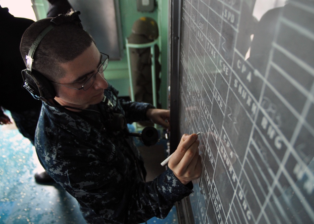 Sailor at work aboard USS Denver