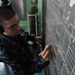 Sailor at work aboard USS Denver