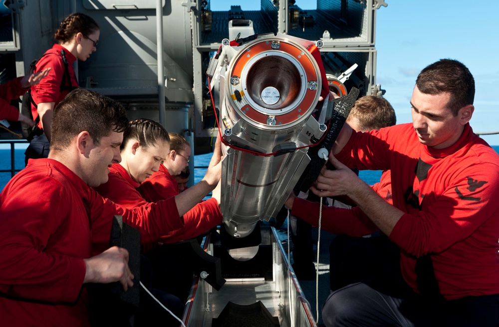 USS John C. Stennis remove a RIM-7 Sea Sparrow missile