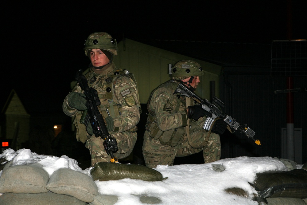 Multinational forces bury their tracks along the snow-covered 'Black Forest' region of Bavaria