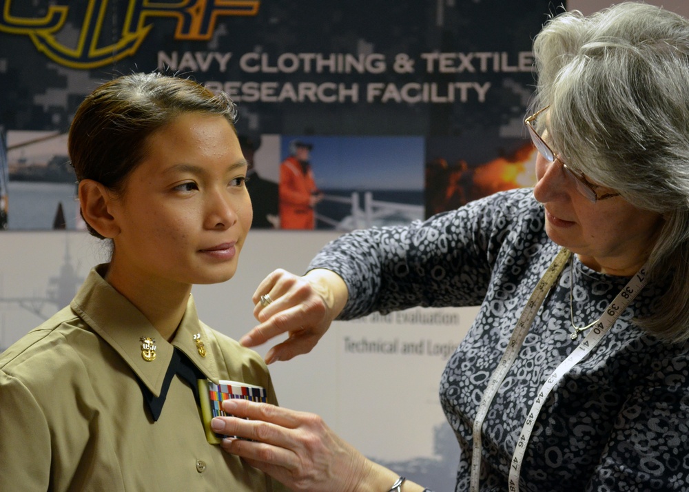 Airman tries on sample uniform