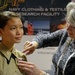 Airman tries on sample uniform