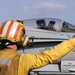 Sailor directs pilot aboard USS Abraham Lincoln