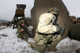 Georgian forces remain vigilant when under siege of insurgent bombardment during readiness exercise