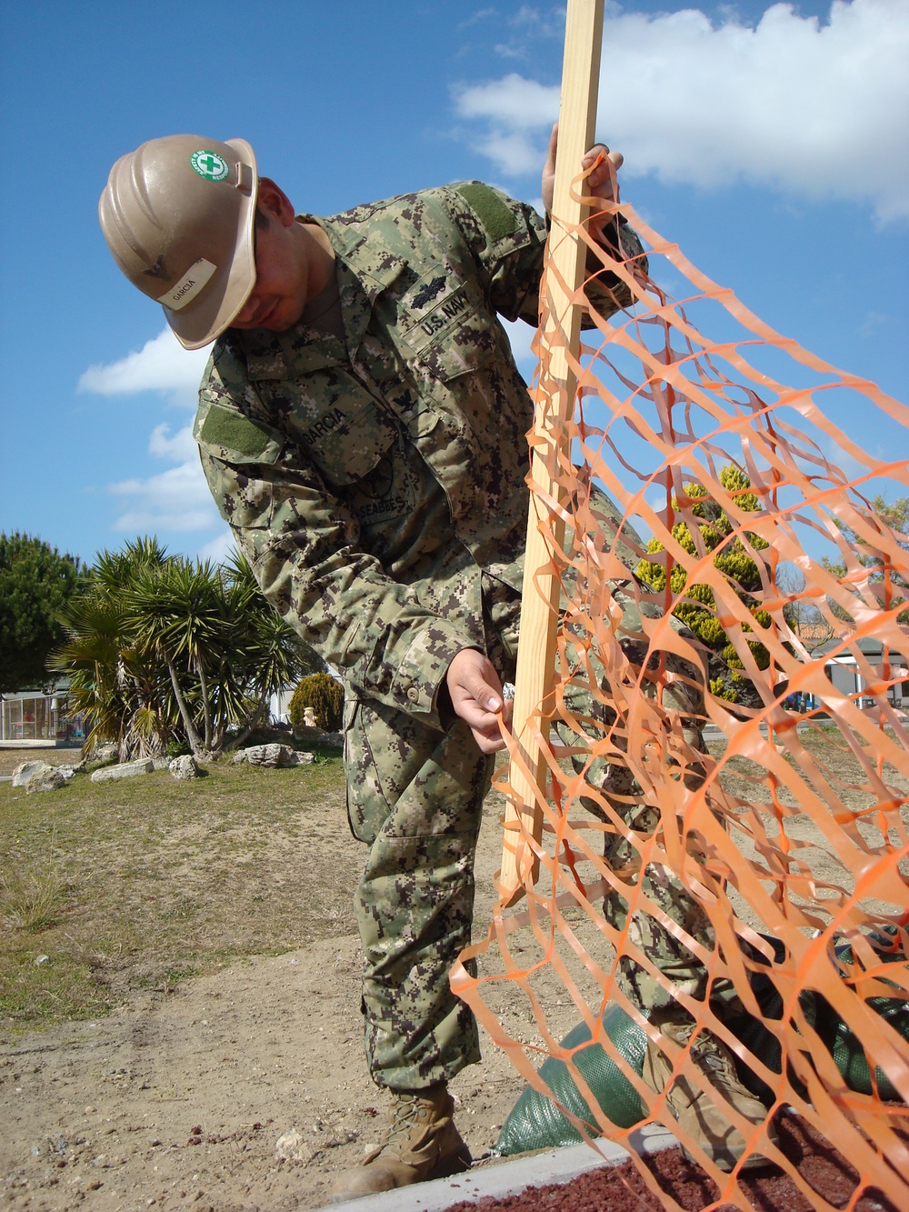NMCB 3 Seabee places safety fencing