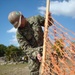 NMCB 3 Seabee places safety fencing