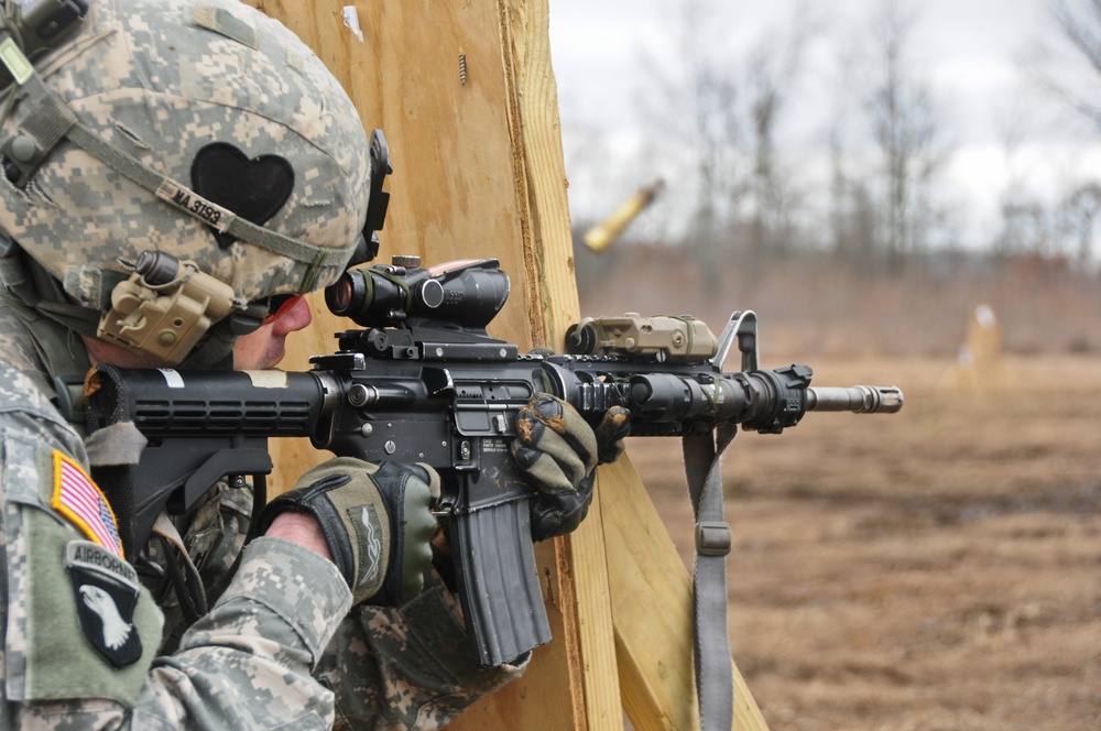 Deploying Security Force Assistance Team Soldier fires M4 carbine