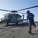 Sailor secures helicopter aboard USS Cape St. George