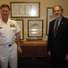 Naval leaders pose in front of USS Freedom model