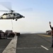 Sailor directs MH-60S Sea Hawk on USS Abraham Lincoln's flight deck