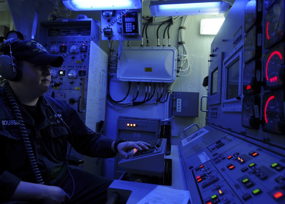 USS Momsen sailor monitors engine during drill