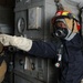 USS Abraham Lincoln sailor directs team during drill