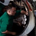 USS Abraham Lincoln sailor cleans engine cap