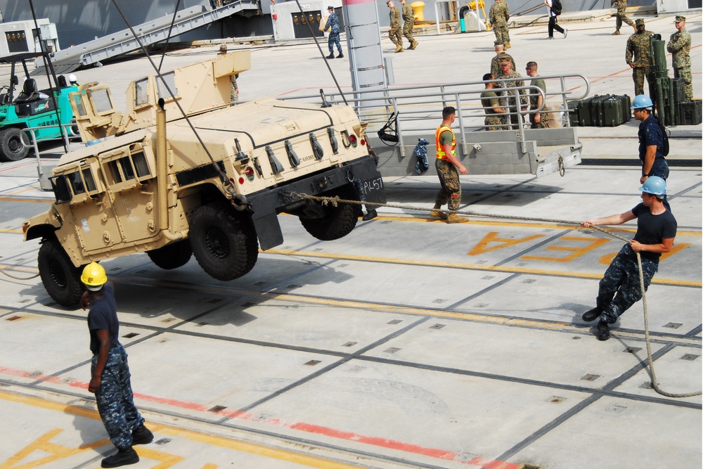 USS Tortuga offload vehicles