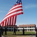 USS Fort McHenry sailors raise flag