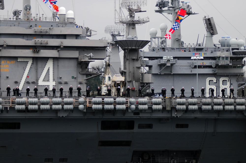 USS John C. Stennis sailors man the rails