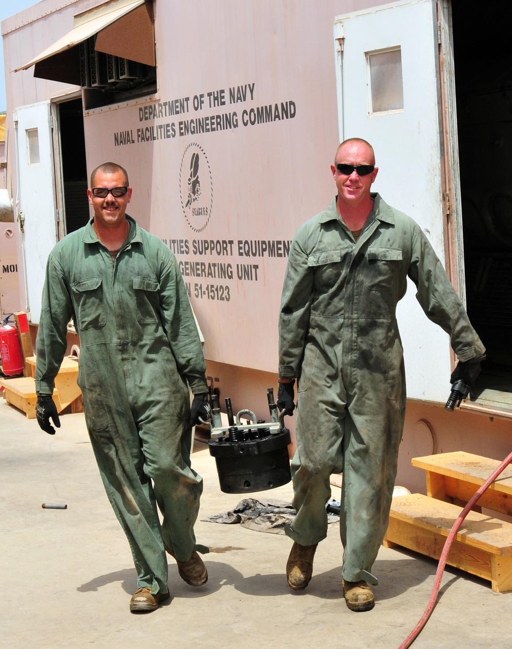 Seabee MUSE technicians inspect and install generators on Camp Lemonnier