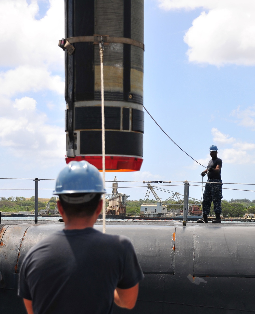 Loading a Tomahawk land attack missile onto USS Michigan