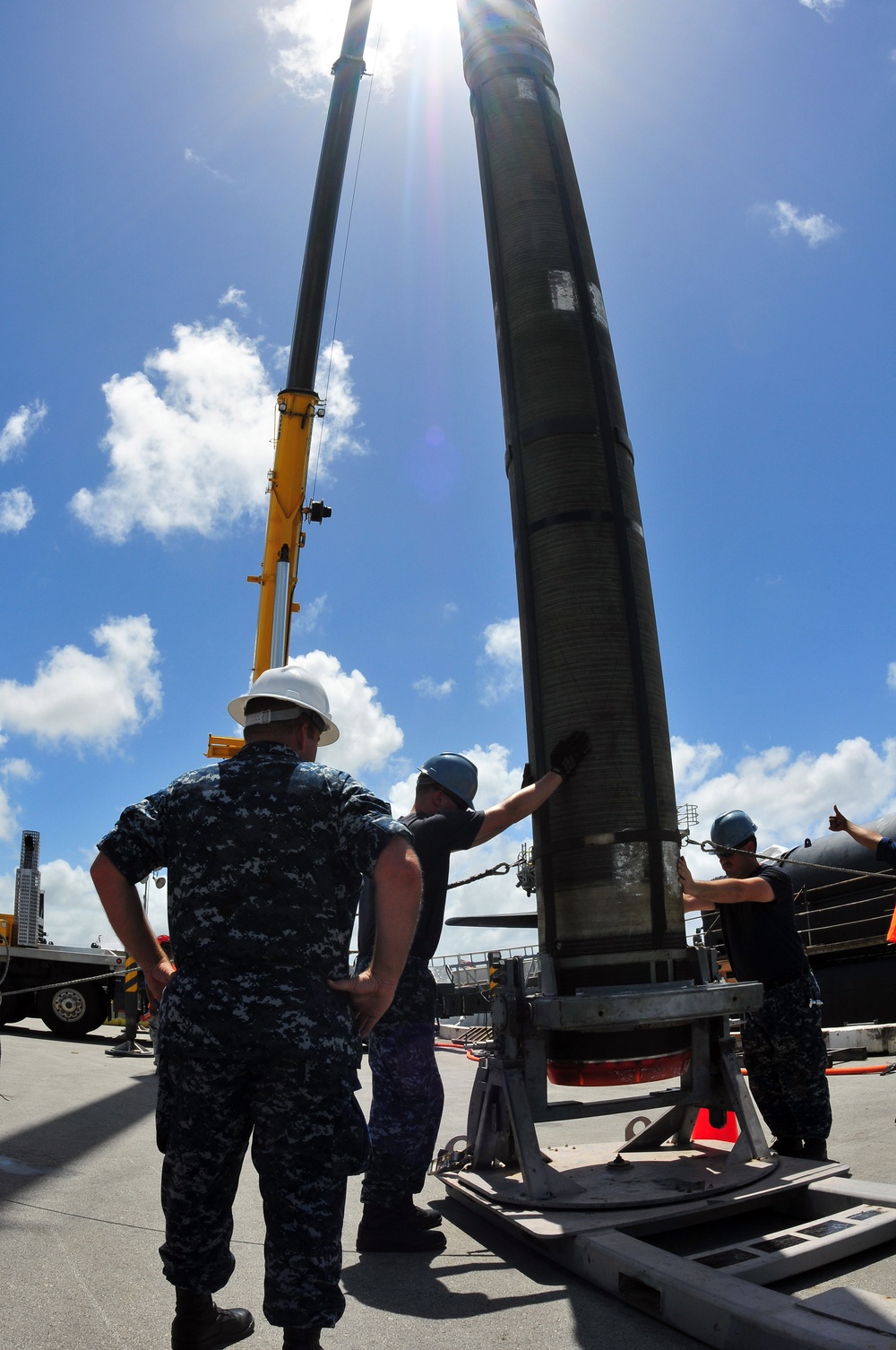 Loading a Tomahawk land attack missile onto USS Michigan